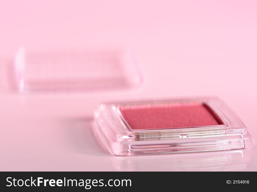 Cosmetic product close-up with pink cast. Cosmetic product close-up with pink cast