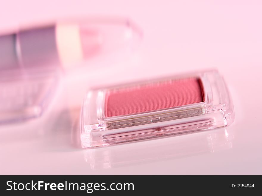 Cosmetic product close-up with pink cast. Cosmetic product close-up with pink cast