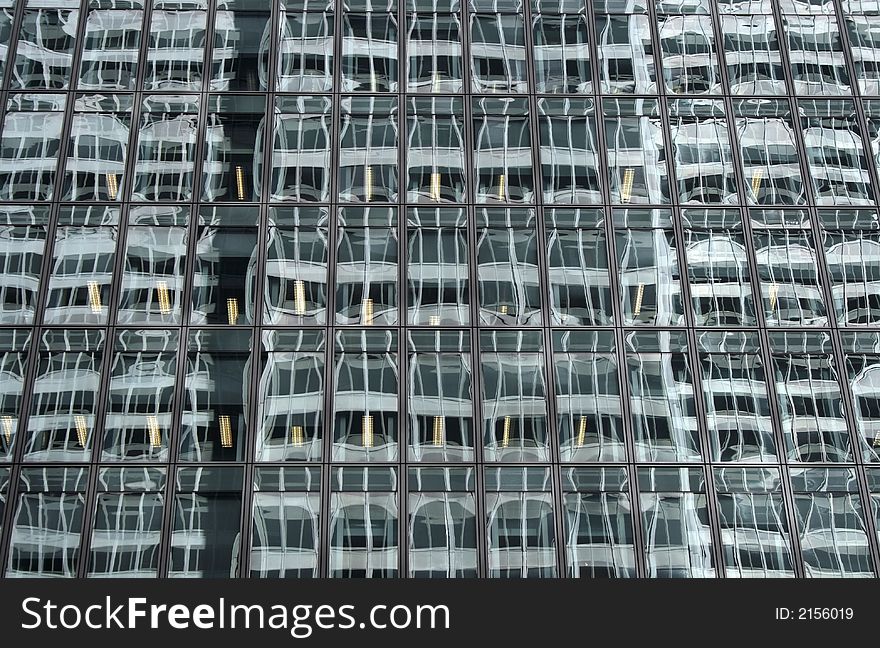 Abstract reflections in the windows of a corporate building.