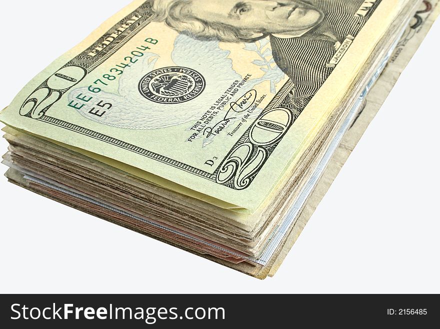 A wad of American dollars isolated on a white background. A wad of American dollars isolated on a white background