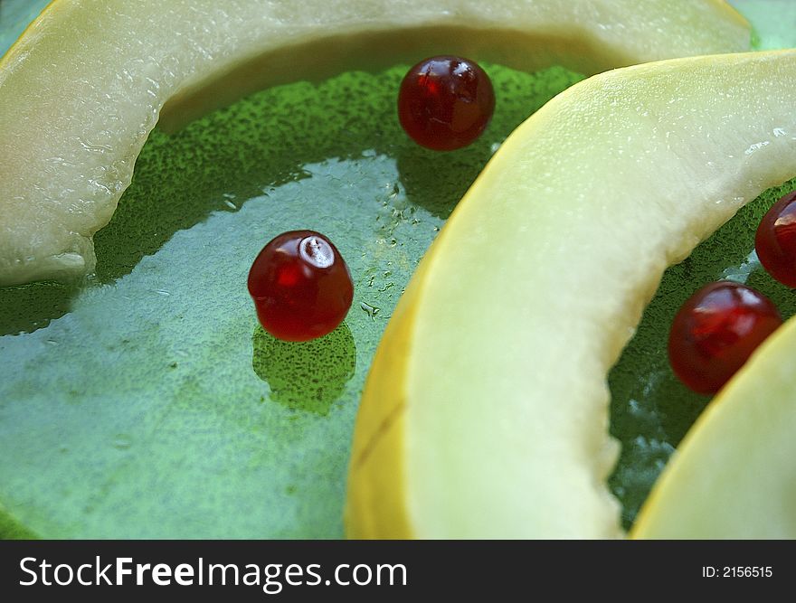 Sliced melon and cherrys in summer time