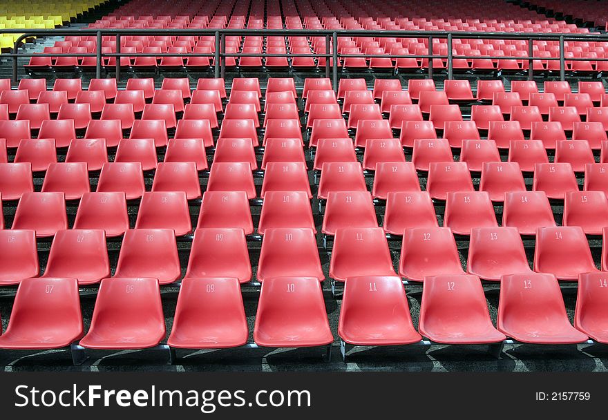 Many Empty Seats In Rows In An Outdoor Stadium. Many Empty Seats In Rows In An Outdoor Stadium