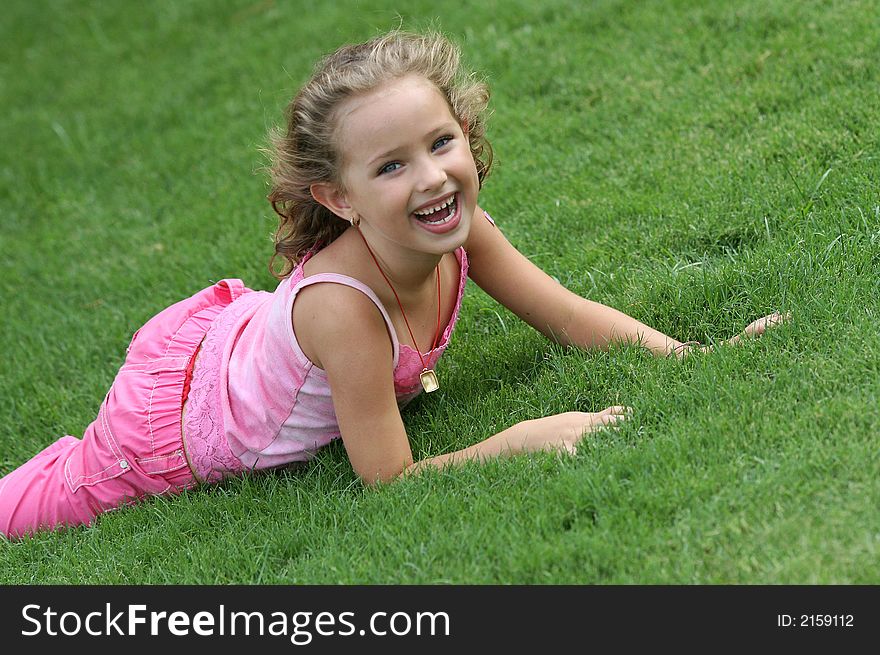 Little girl play on the grass. Little girl play on the grass