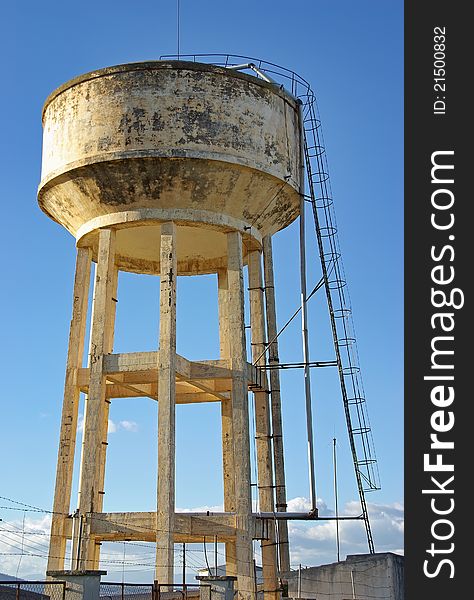 Big emergency water tank elevated over a mortar structure. Big emergency water tank elevated over a mortar structure