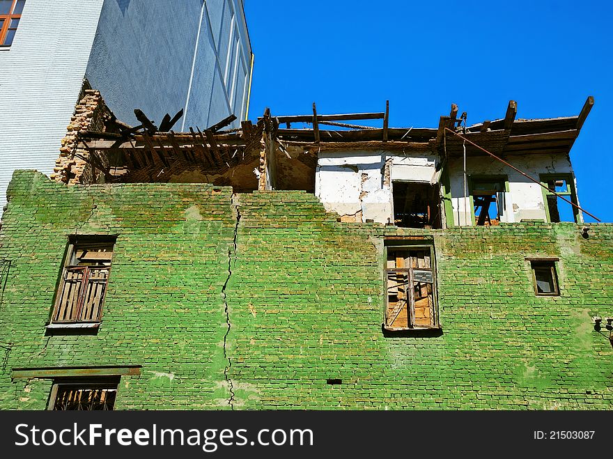 Damaged old house and crack on brick wall. Damaged old house and crack on brick wall