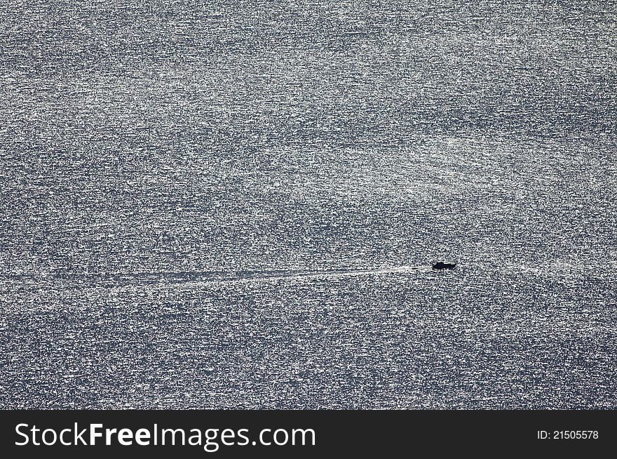 Small boat at open sea sailing through waves. Small boat at open sea sailing through waves