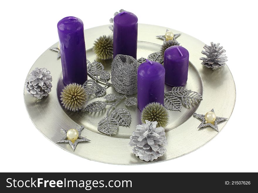 Christmas wreath isolated on white background. Focus on the foreground, intentional shallow depth of field. Studio work.