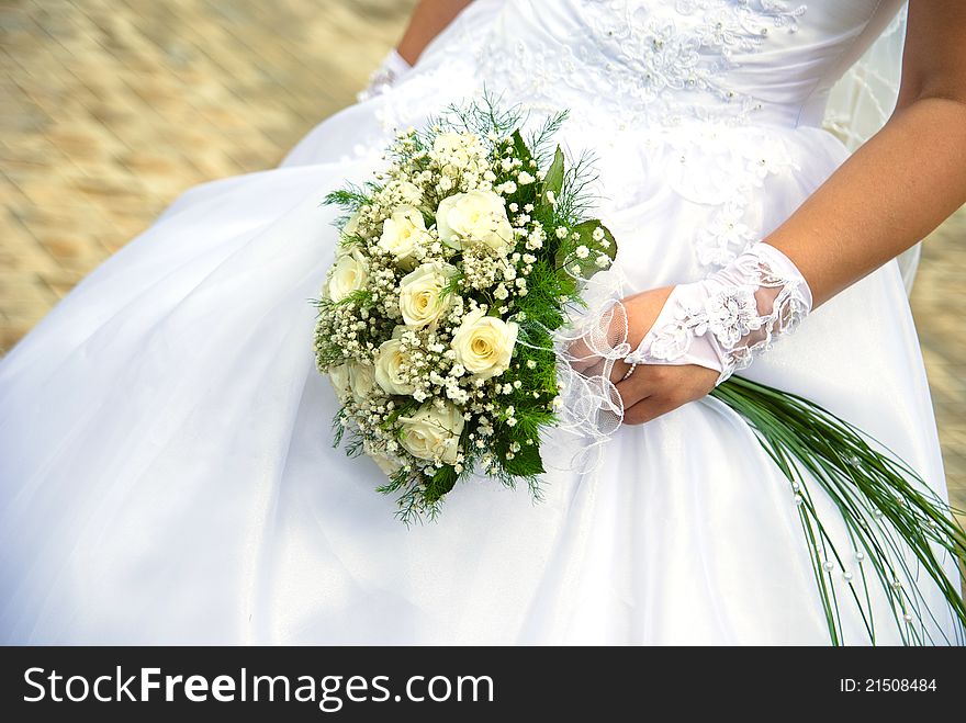 Bridal bouquet in the hand of bride. Bridal bouquet in the hand of bride