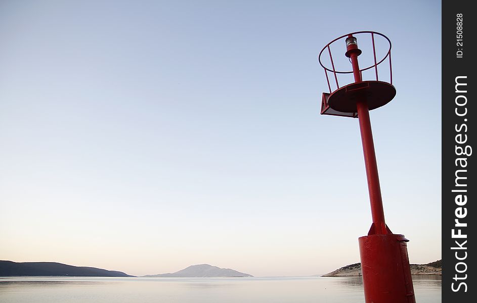 Red lantern in front of blue sky and calm sea