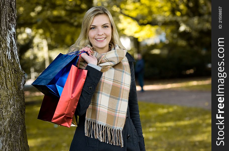 Young happy beauty woman with shopping bags. Young happy beauty woman with shopping bags