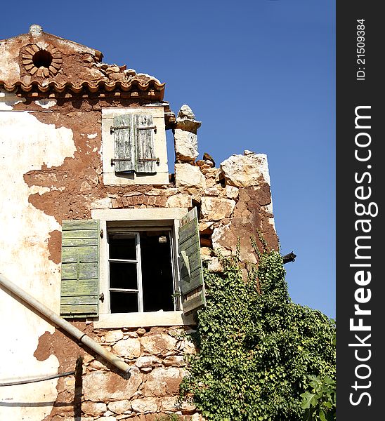 A part of ruin and abandoned house with destroyed wall and old windows. A part of ruin and abandoned house with destroyed wall and old windows