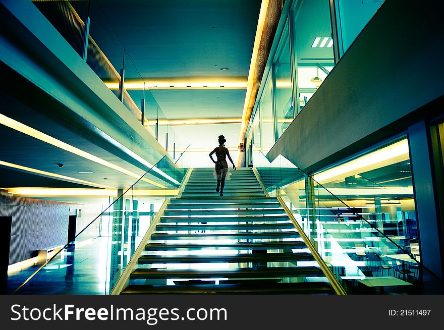Silhouette of a beautiful woman walking up stairs. Silhouette of a beautiful woman walking up stairs