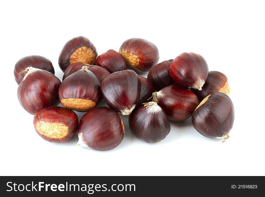 Pile of chestnuts on white background