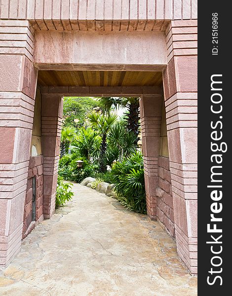 Stone gate entrance to a tunnel-shaped luxury hotel. Stone gate entrance to a tunnel-shaped luxury hotel.