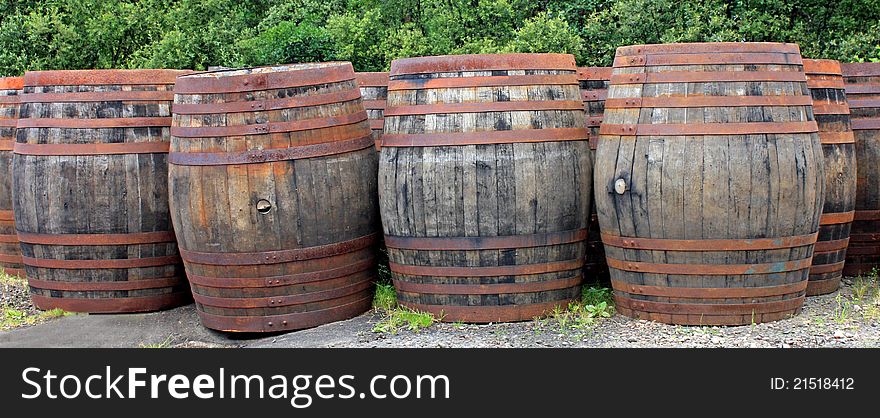 A Collection of Old Wooden Whisky Oak Barrels.