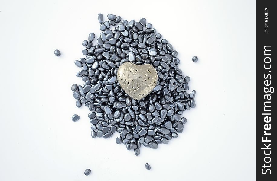 Fool's gold (pyrite) heart on hematite beads. Fool's gold (pyrite) heart on hematite beads