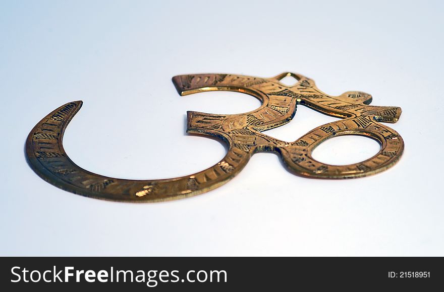 Brass OM (Aum) symbol (from buddhism and hinduism). Brass OM (Aum) symbol (from buddhism and hinduism)