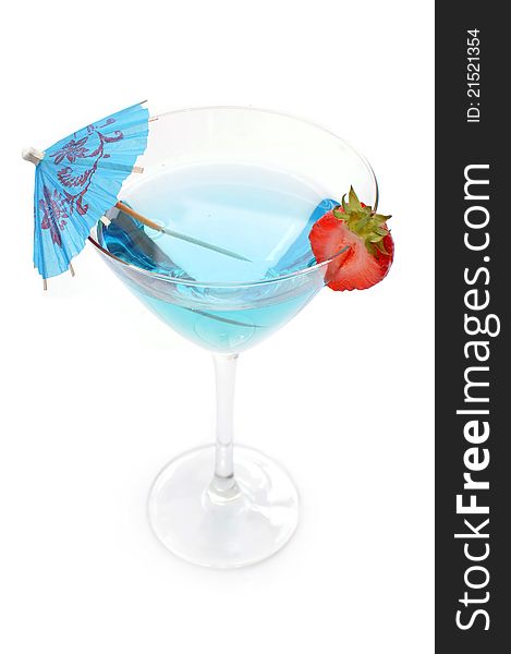 Blue cocktail with a slice strawberry and umbrella