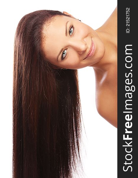 Young and beautiful woman with long hair against white background