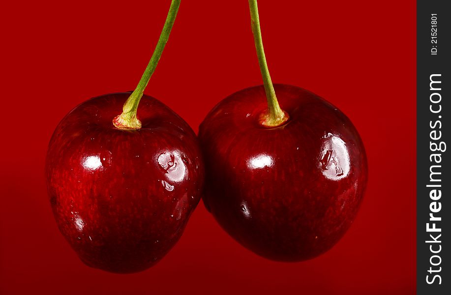 Close up of cherry against red background