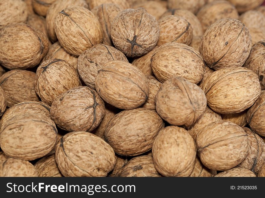 Big walnuts in nutshell as background