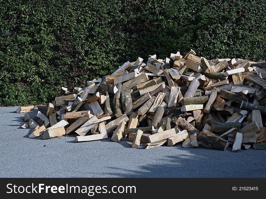 Pile of wood. Cut wood. Pile of wood on a street.