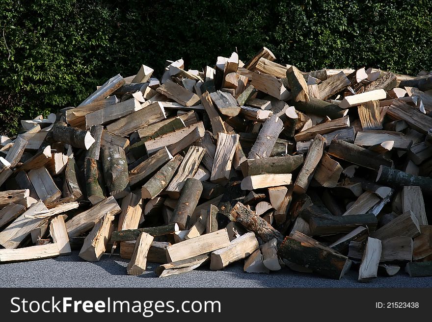 Pile of wood.
Cut wood.
Pile of wood on a street.