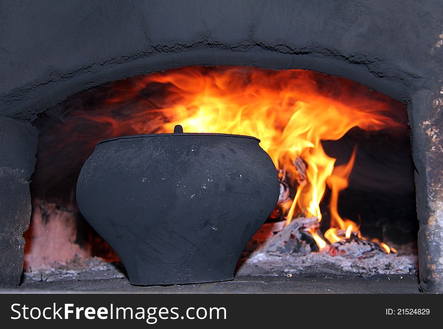 Rustic dish prepared in the oven on fire. Rustic dish prepared in the oven on fire