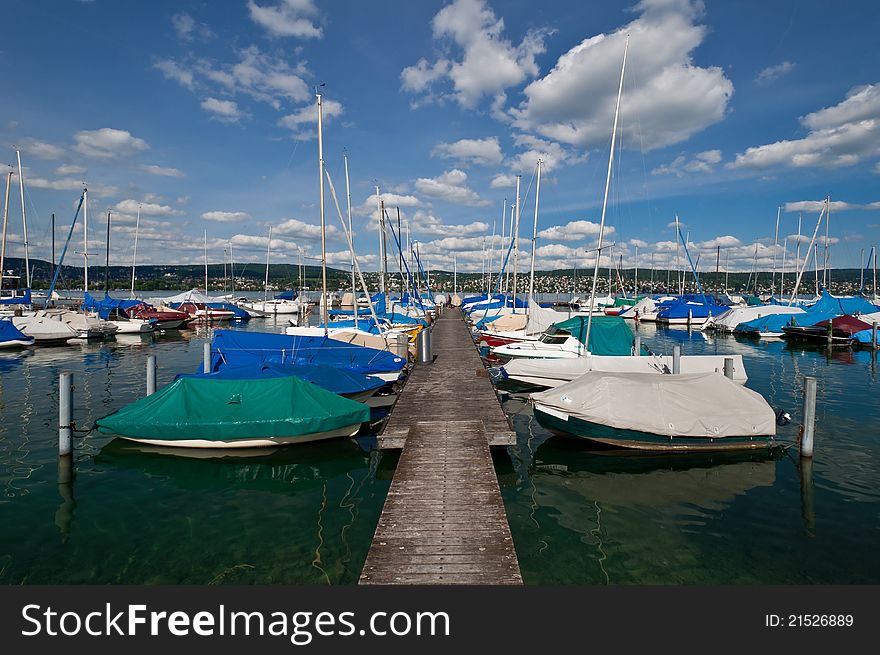 Zurich lake view with boats and dock. Switzerland. Zurich lake view with boats and dock. Switzerland.