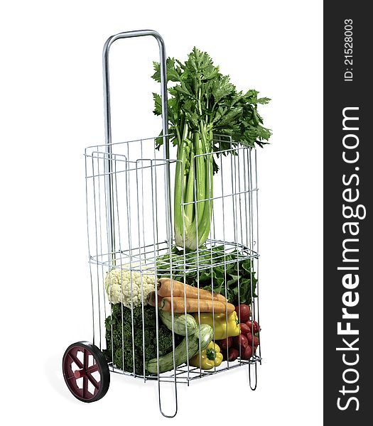 Isolated grocery cart with vegetables. Isolated grocery cart with vegetables