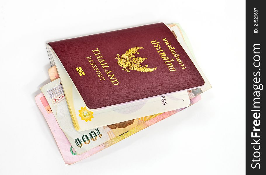 Thailand passport and Thai money on white background