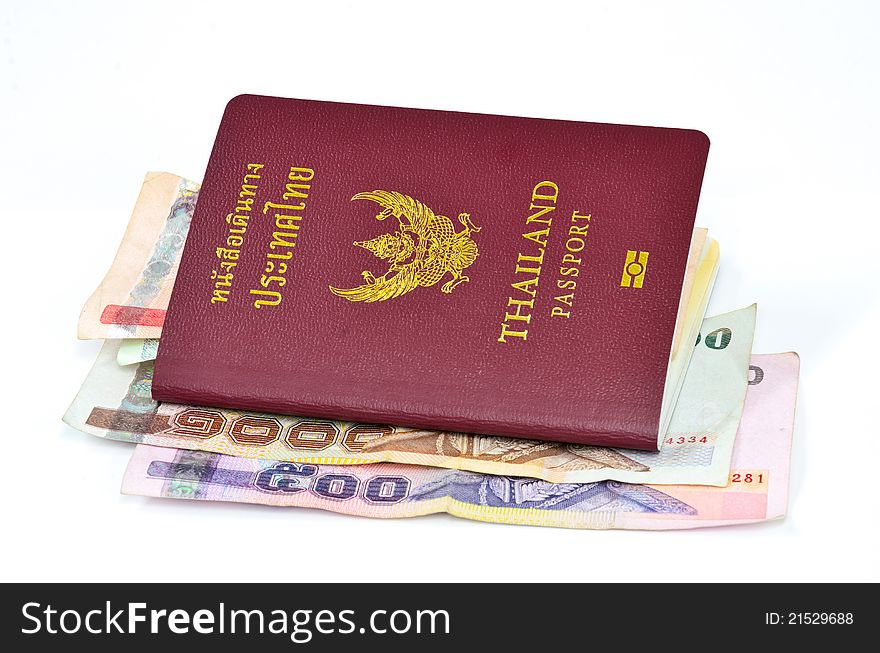 Thailand passport and Thai money on white background