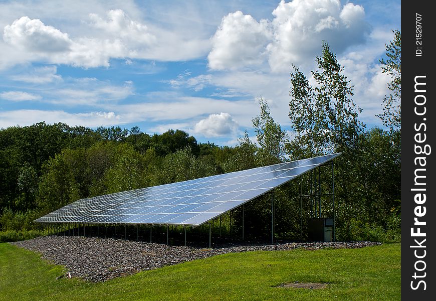 Industrial solar panel nestled in country greenery. Industrial solar panel nestled in country greenery.