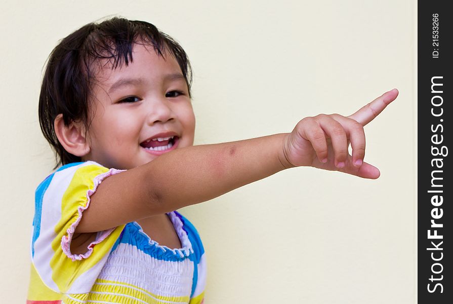 Thai child pointing to the front  which very cute, naturally. Thai child pointing to the front  which very cute, naturally.