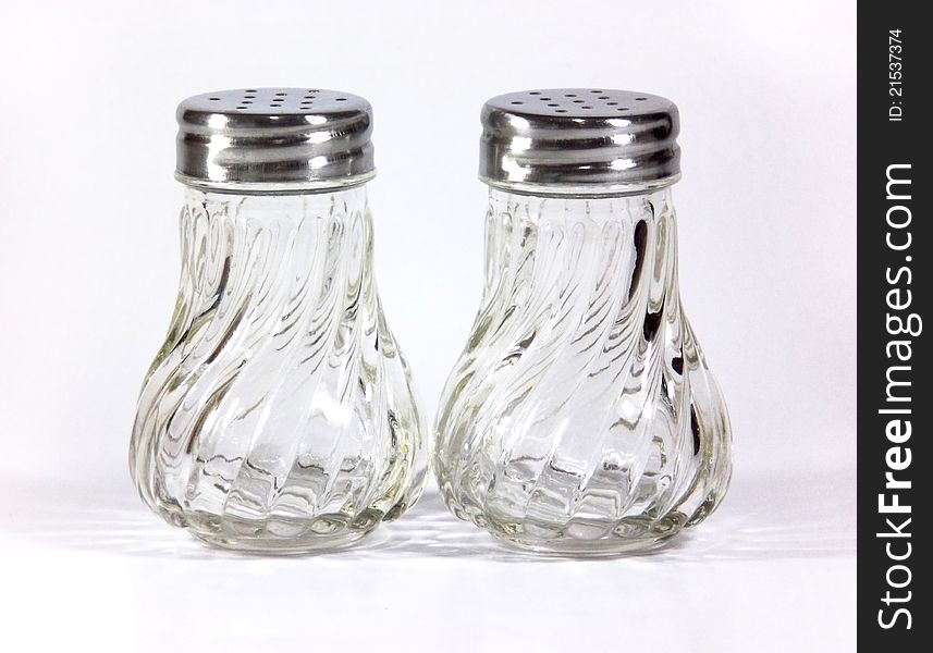 Glass empty Salt and pepper shakers on table