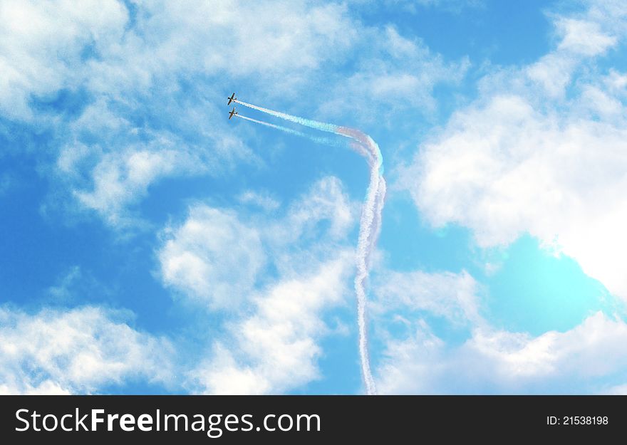 Acrobatics with two planes through the clouds. Acrobatics with two planes through the clouds