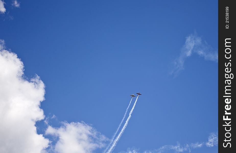 Acrobatics with two planes through the clouds. Acrobatics with two planes through the clouds