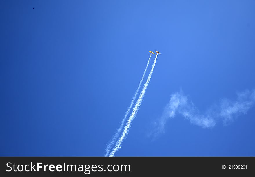 Acrobatics with two planes through the clouds. Acrobatics with two planes through the clouds