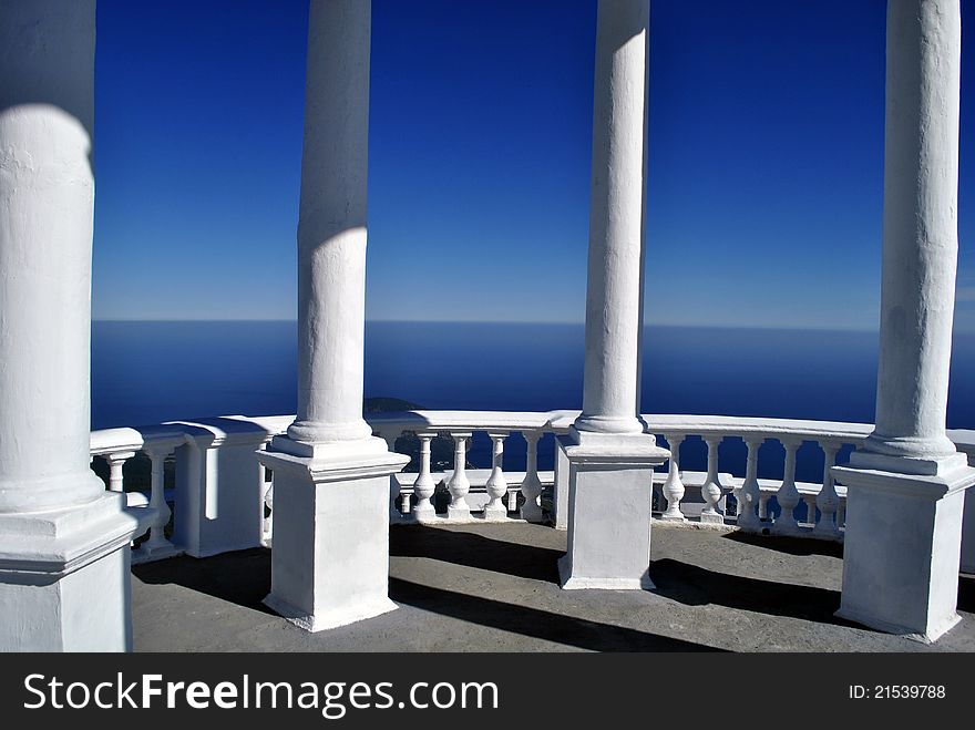 White arbor with the columns in front of the sea. White arbor with the columns in front of the sea