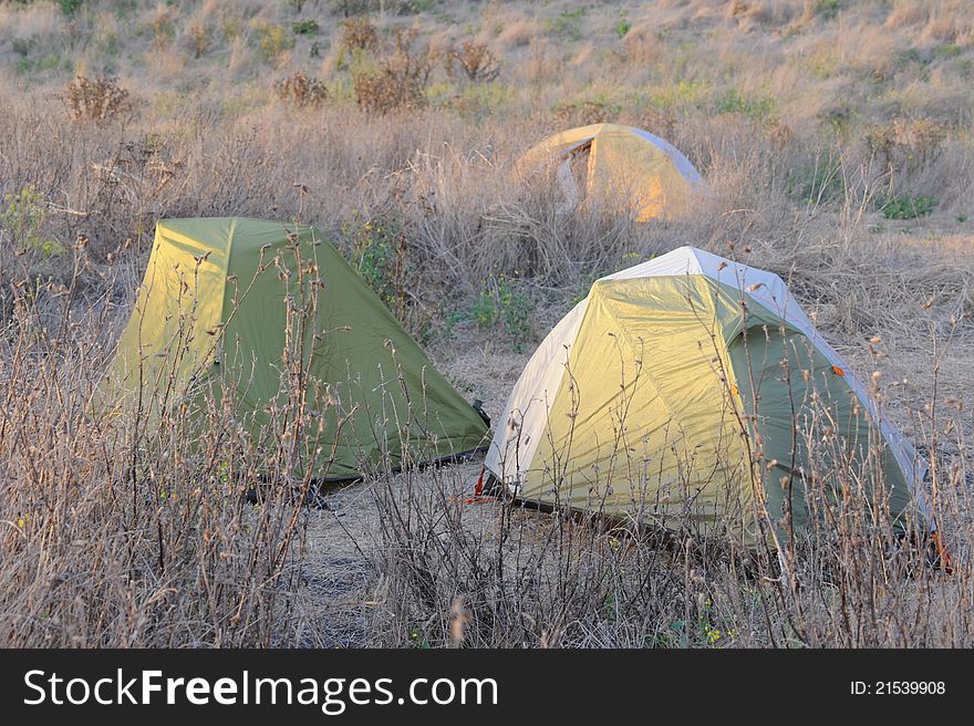 Photo of camping tents on site in nature