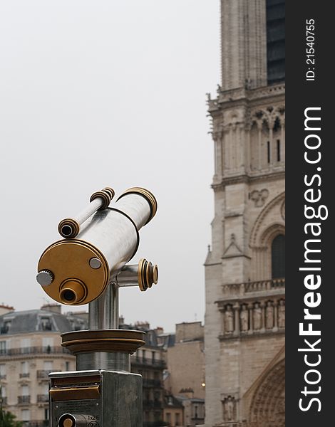 Telescope of stainless steel near Not-re-Dame Cathedral in Paris