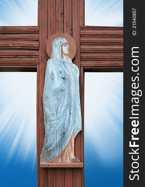 Virgin Mary prays for the old wooden cross. Virgin Mary prays for the old wooden cross