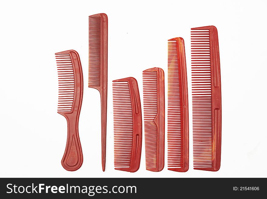 Assorted plastic combs on white background