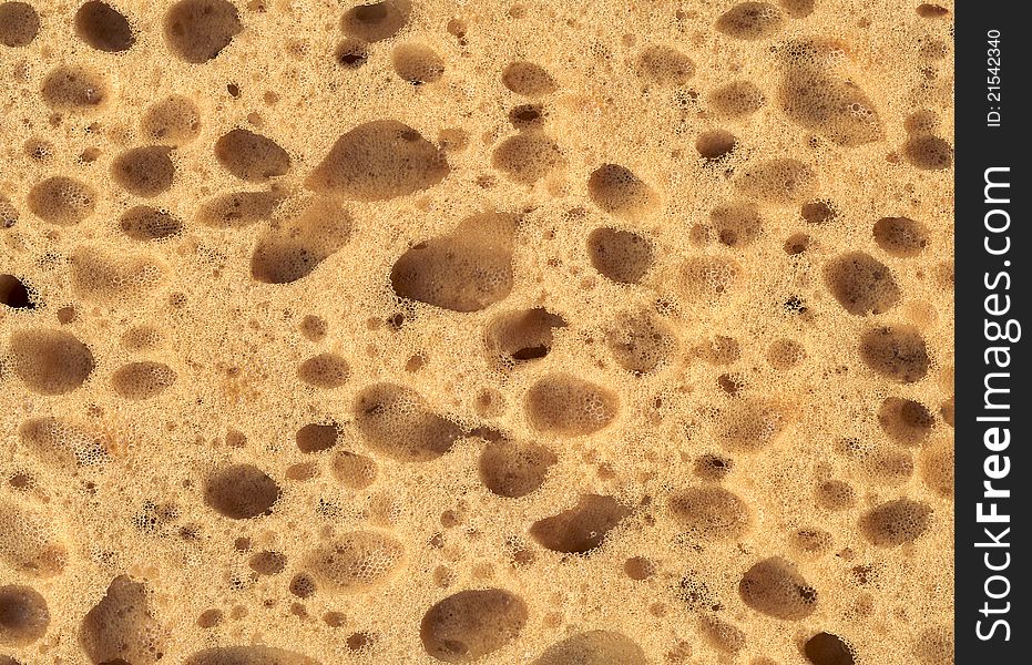 Close up on a yellow sponge, texture. Close up on a yellow sponge, texture