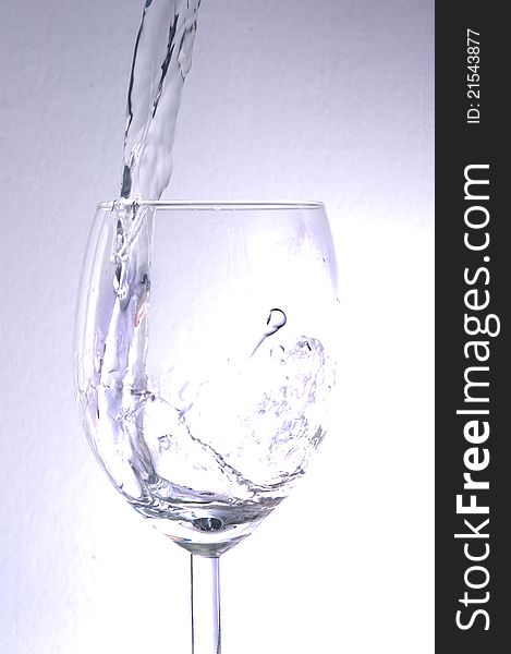 Water poured into a glass. Water poured into a glass