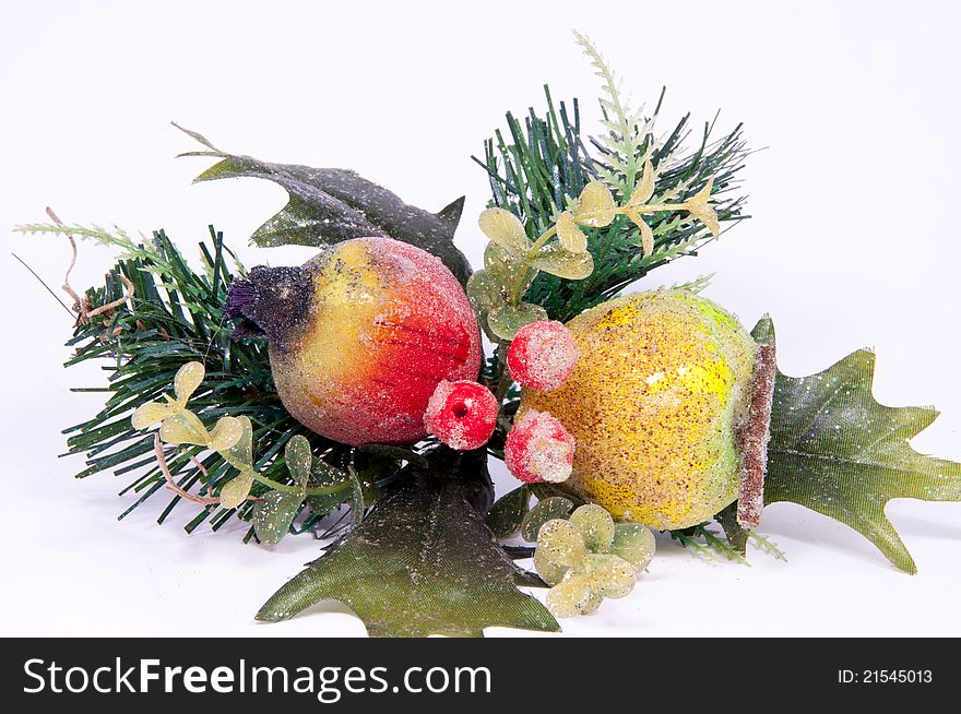 Arrangement of pears, apples, and pine branches.
