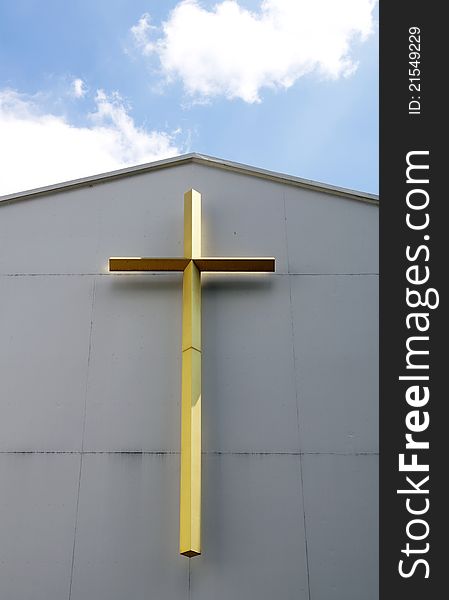 The golden cross at church