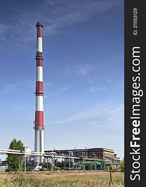 Ironworks with chimney in countryside. Ironworks with chimney in countryside