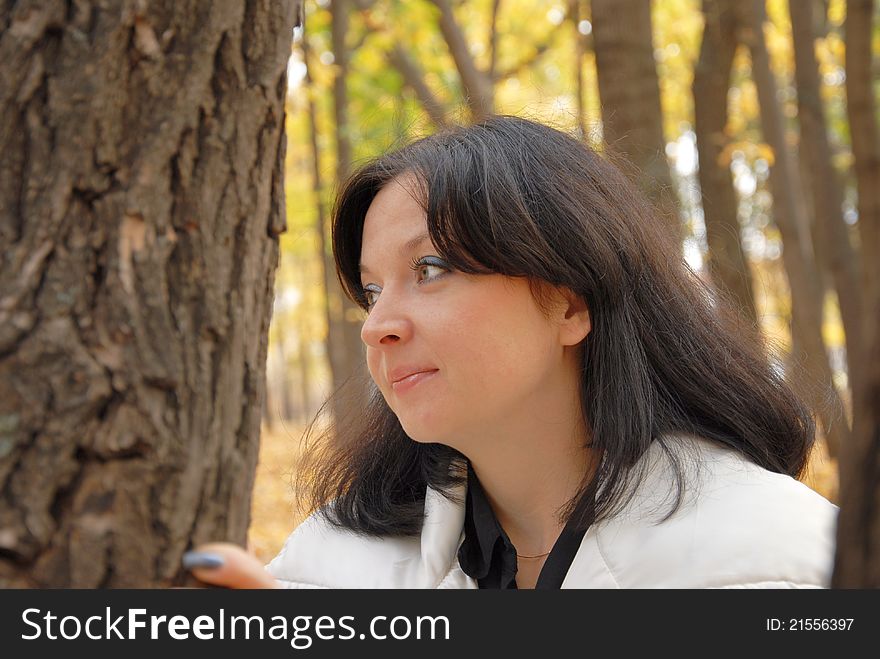 Portrait of young girl in a forest in autumn