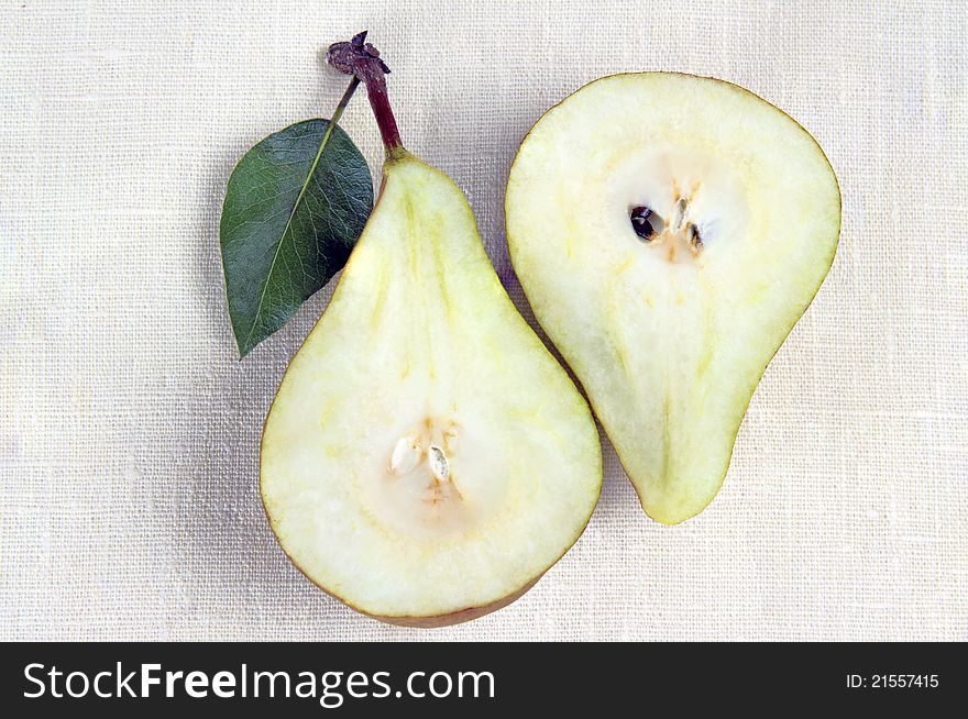 Two halves of pears on a white background